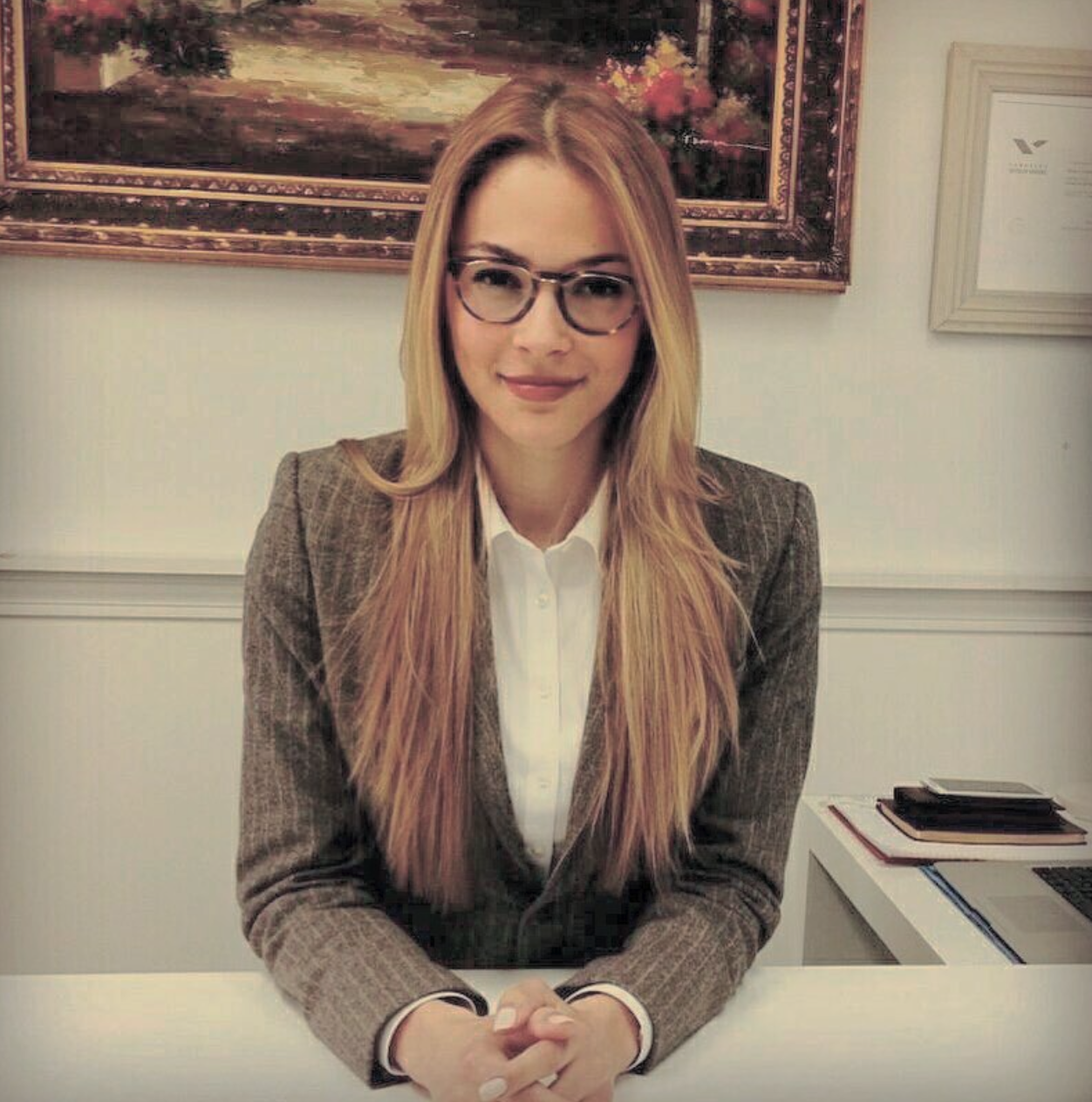 Attorney Gabriella Bonfim Moraes at her desk